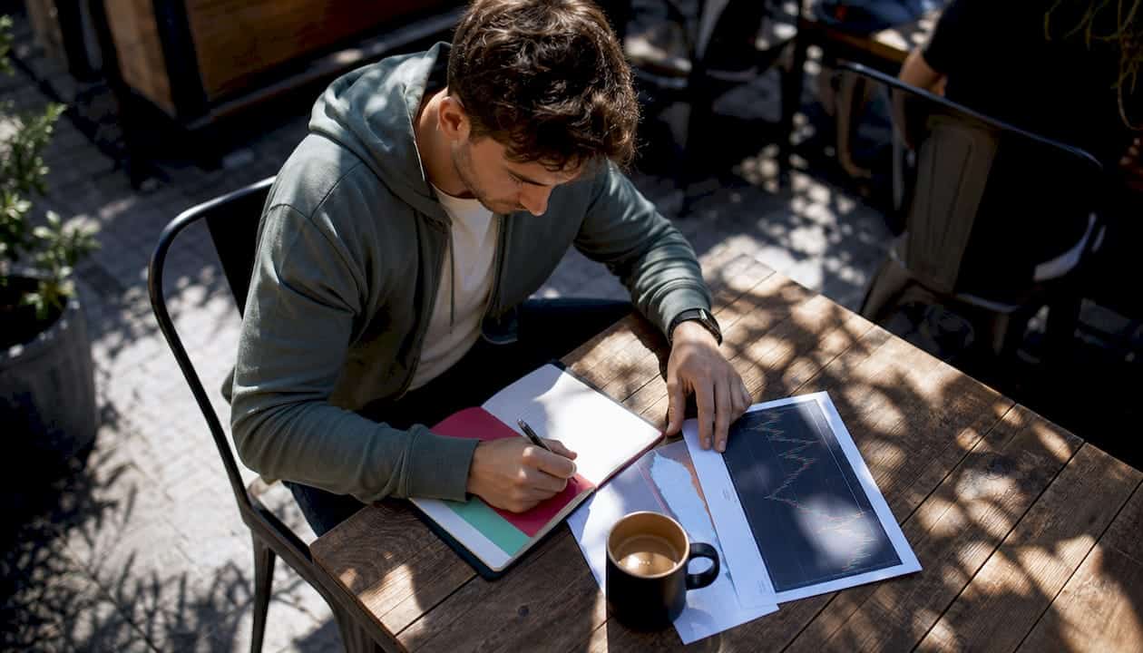Forex trader reviewing account scaling documents