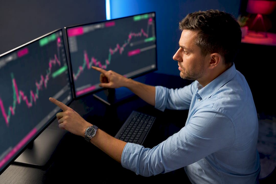 Trader reviewing duplicate forex trade screens
